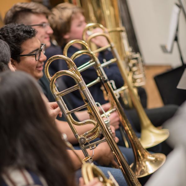 the trombone section during rehearsal