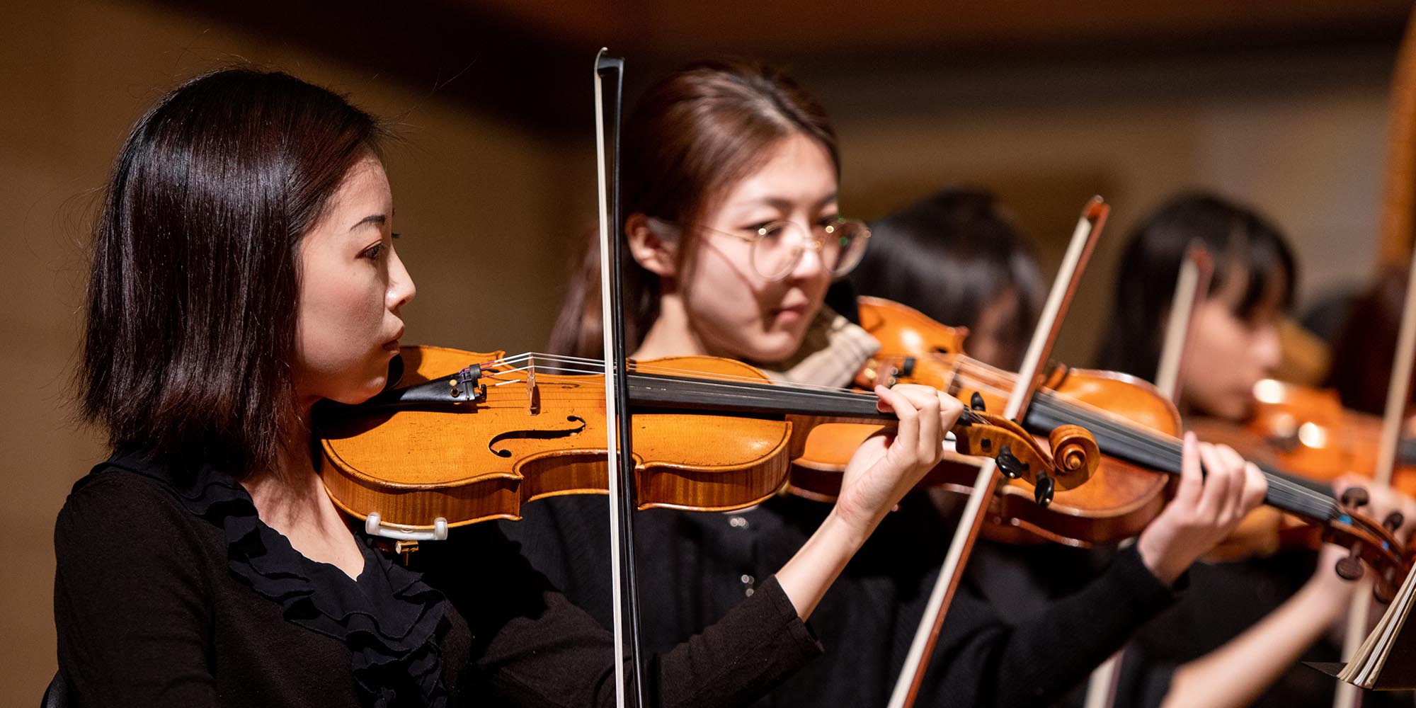 A SFCM student violinist performing in the SFCM orchestra