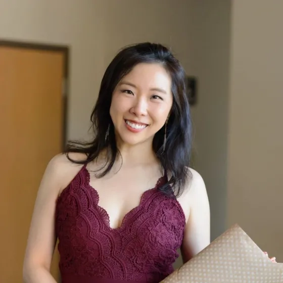 Chia-Lin Yang holding flowers after a performance