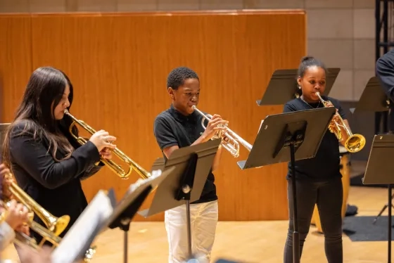 Students from the Oakland Public Conservatory of Music rehearse alongside the CBC.