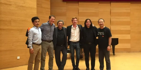 Students and faculty in a recital hall