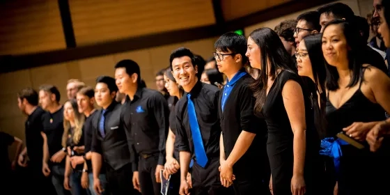 A photo of people singing