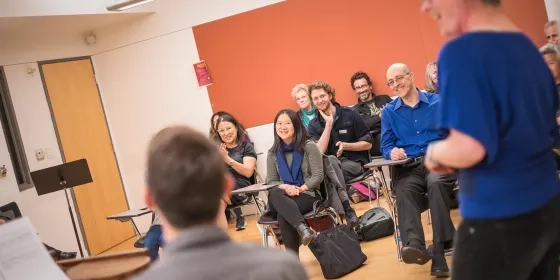 A classroom full of adults continuing their education